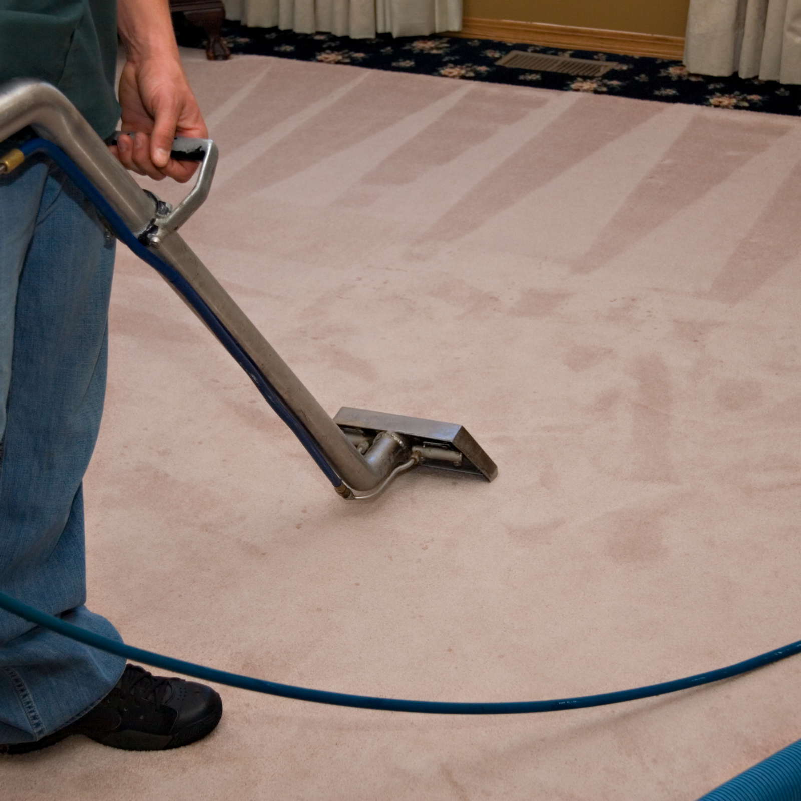 man using cleaning equipment